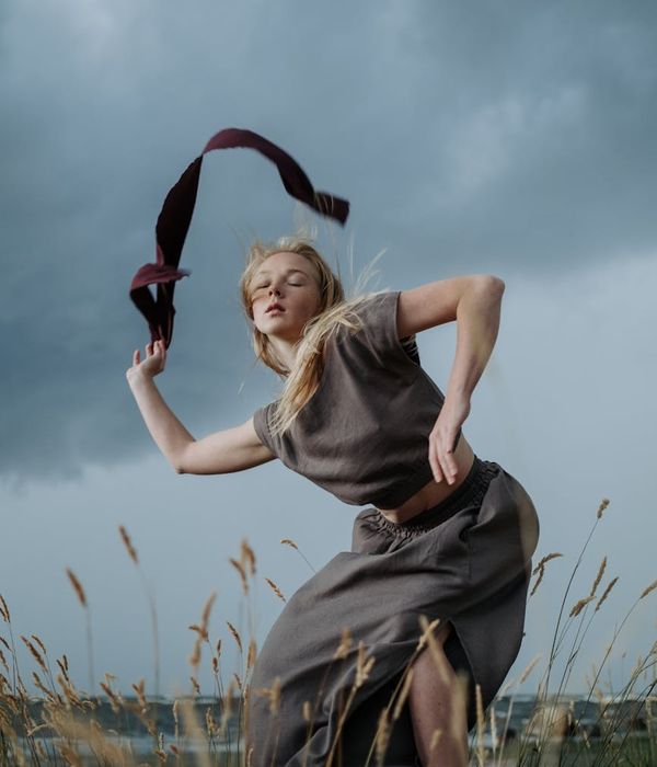 Person in a dynamic yoga pose showing fluid movement.