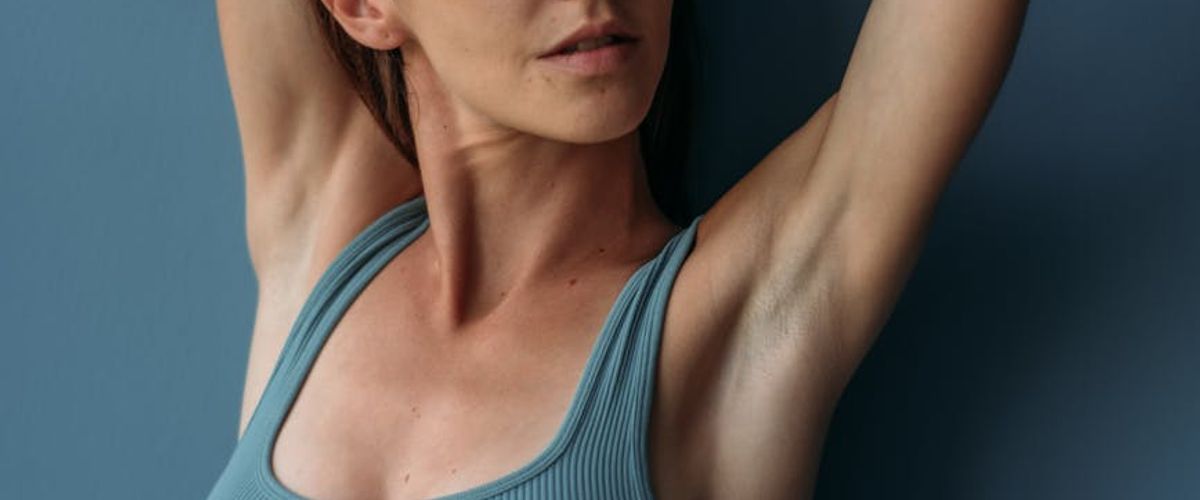 Woman meditating in a calm, modern studio setting, symbolizing focus.